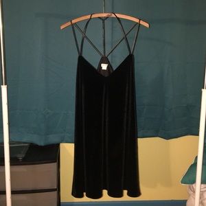 Velvet mini shift with faux leather caged straps.